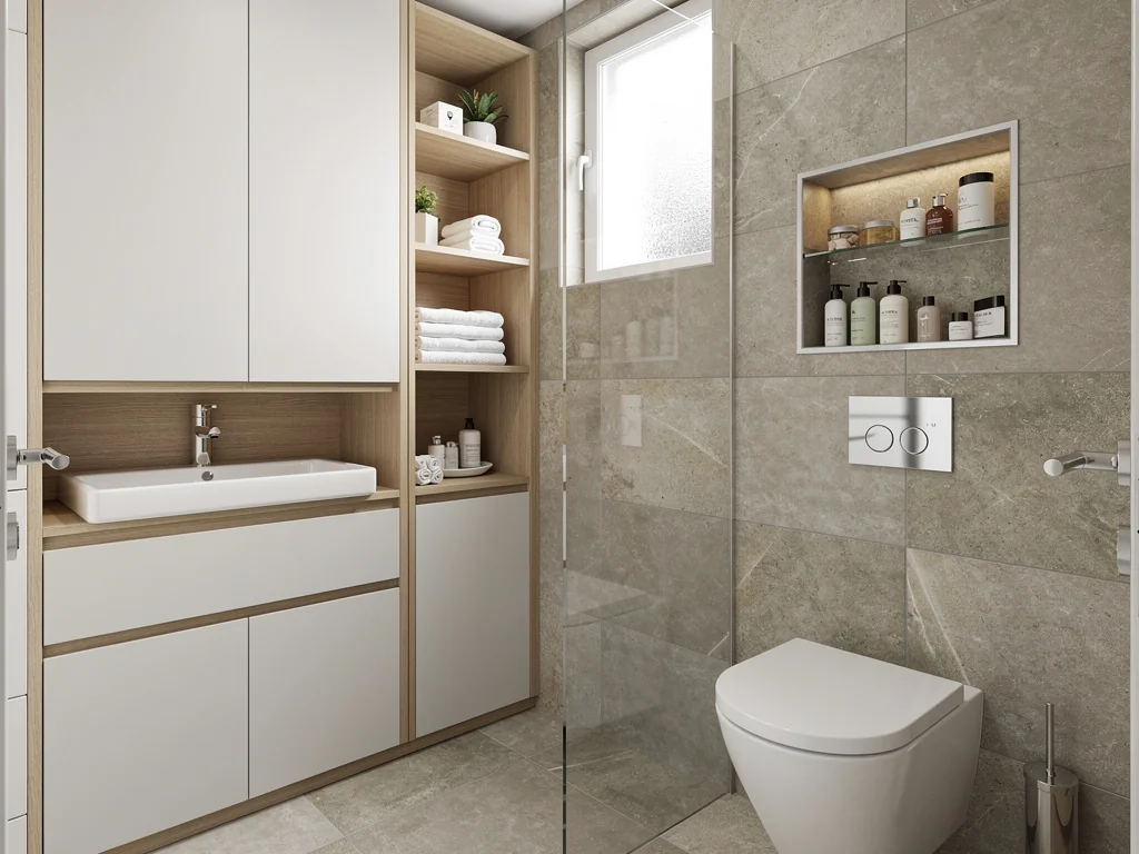 Petite salle de bain optimisée avec rangements sur mesure et niche murale